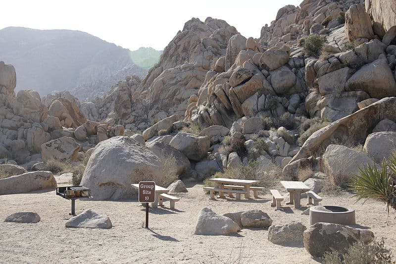 Group Campsite 10 at Indian Cove Campground in Joshua Tree with boulders in the background.