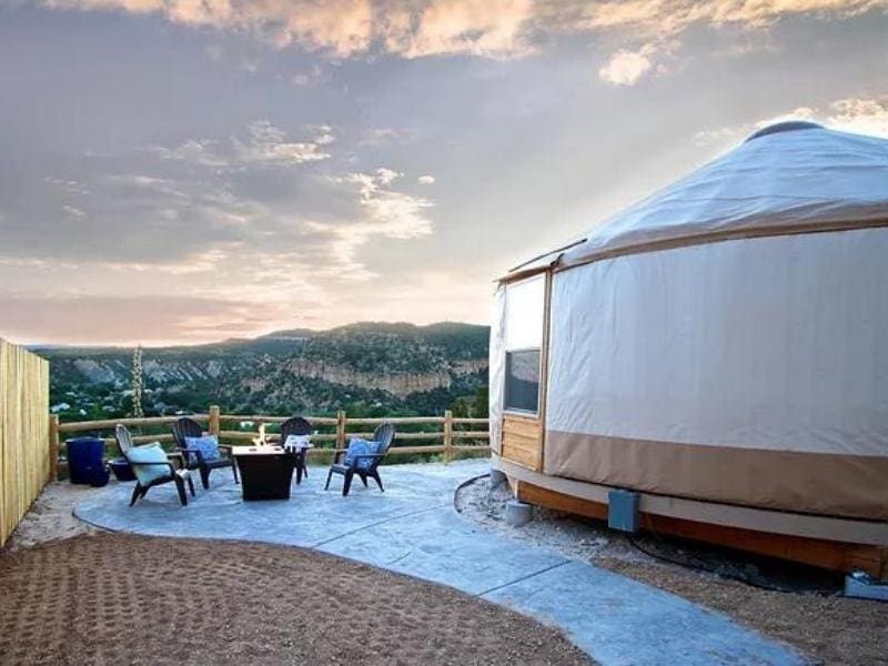 Exterior of large yurt at East Zion Resort with outdoor fire pit and seating