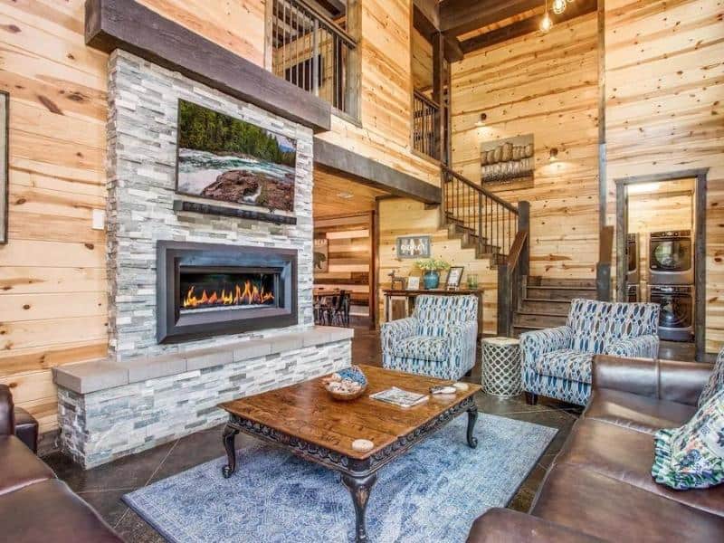 Living area with fireplace at Big Bear Luxury Cabin, Broken Bow