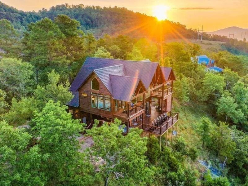 Aerial view of a luxury cabin in Broken Bow at sunset