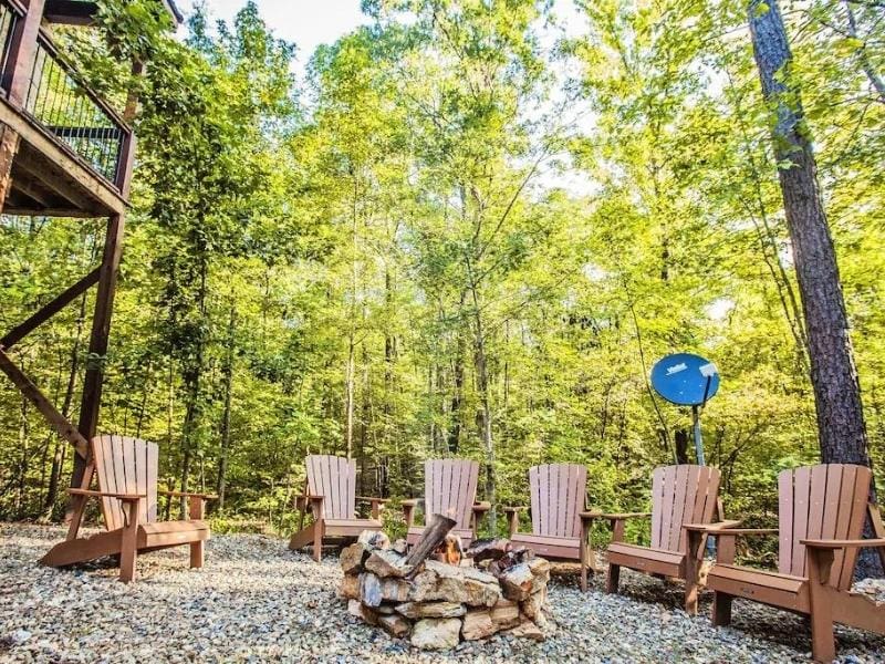 Outdoor fire pit with seating at Lusa Nita Luxury Retreat in Broken Bow, Oklahoma