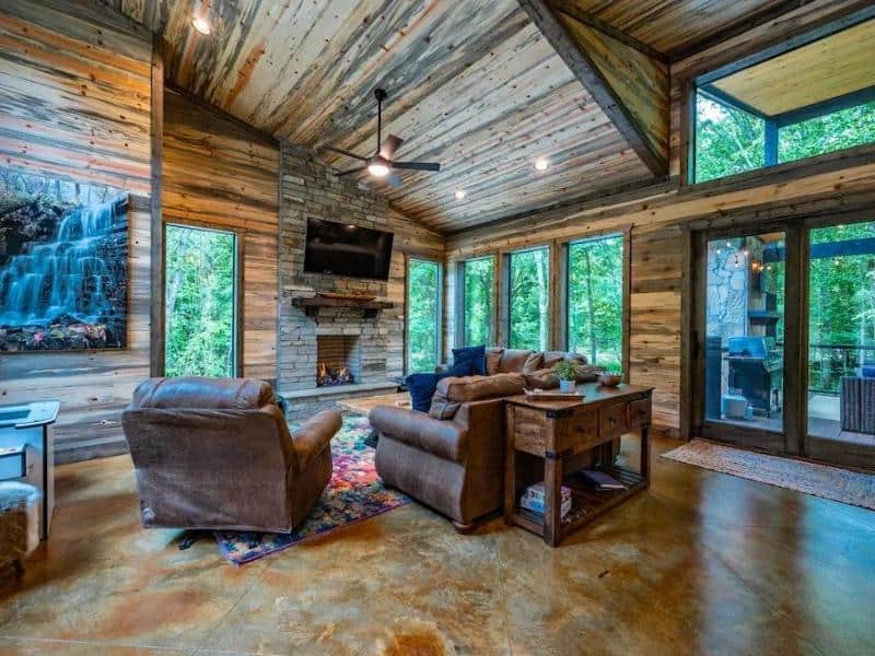 Living area with fireplace at Broken Bow Luxury Cabin