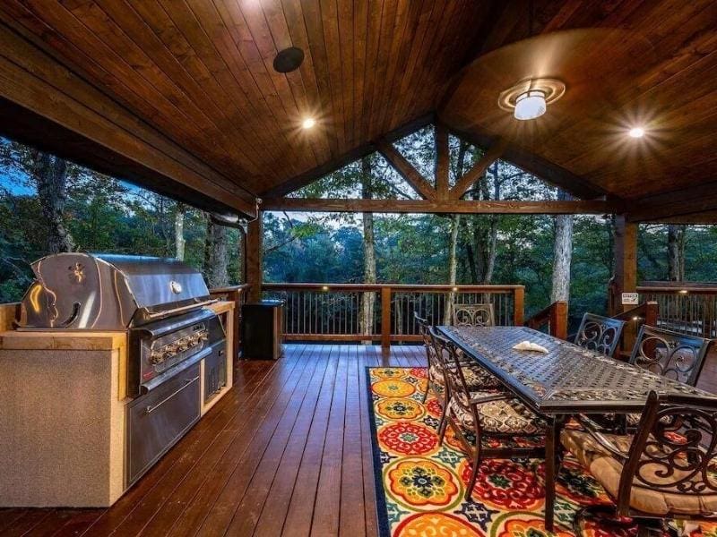 Outdoor deck and entertainment area at one of the luxury cabins in Broken Bow, OK