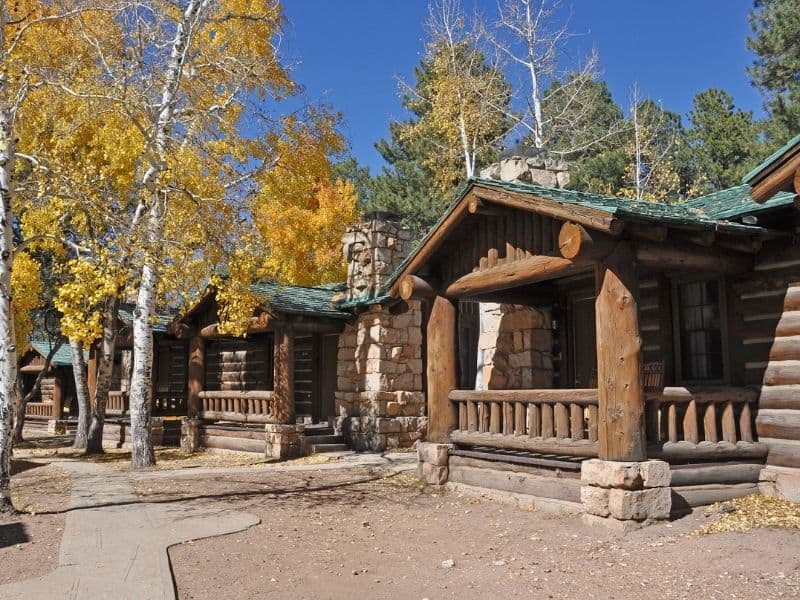 Rustic cabins at Grand Canyon North Rim Lodge surrounded by trees