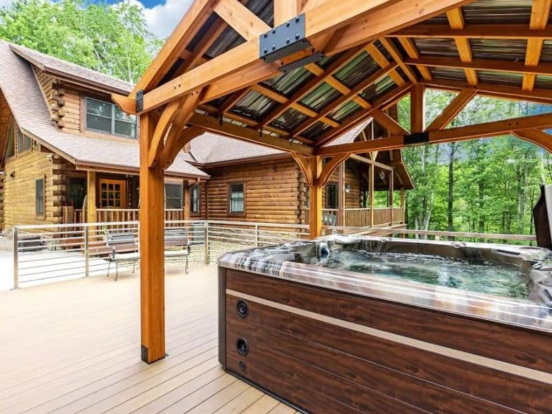 Covered hot tub at large Hocking Hills cabin rental