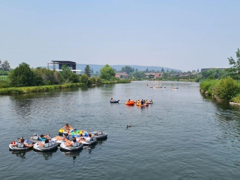 Tubers floating on the Deschutes River in Bend, OR.