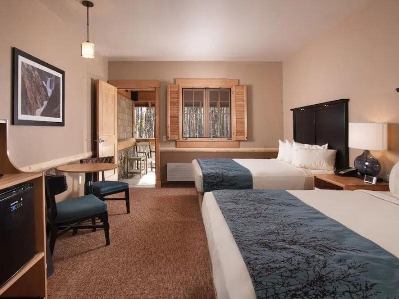 Hotel room at Canyon Lodging and Cabins in Yellowstone National Park with two queen beds.
