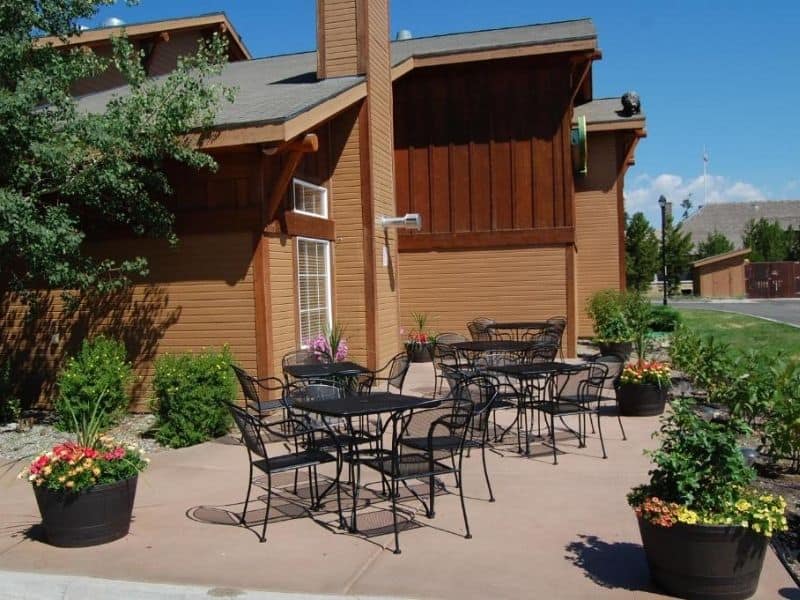 Communal outdoor dining area at Kelly Inn in West Yellowstone