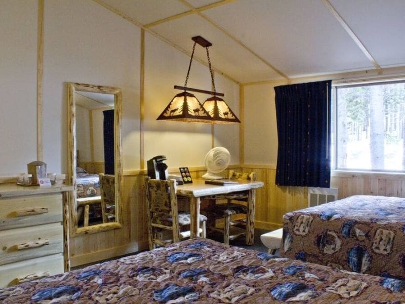Rustic interior of cabin at Lake Lodge Cabins in Yellowstone.