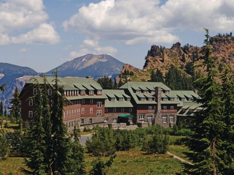 Scenic exterior view of Crater Lake Lodge, Oregon with mountains in the background