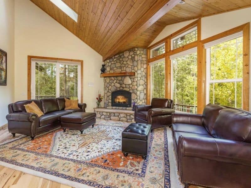 Interior living area and fireplace of Yosemite Insider cabin