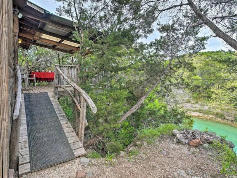 Rustic wood cabin with deck overlooking Honey Creek - Cabins in Turner Falls