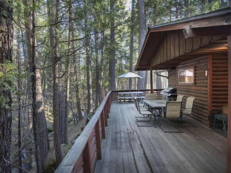 Outdoor deck in forest at Yosemite cabin rental