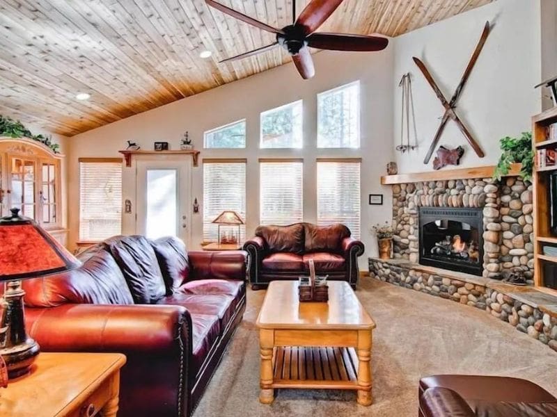 Living area with stone fireplace at Yosemite cabin rental