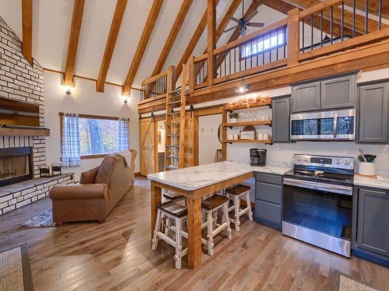 Kitchen and living area in cozy modern farmhouse vrbo in Hocking Hills, OH