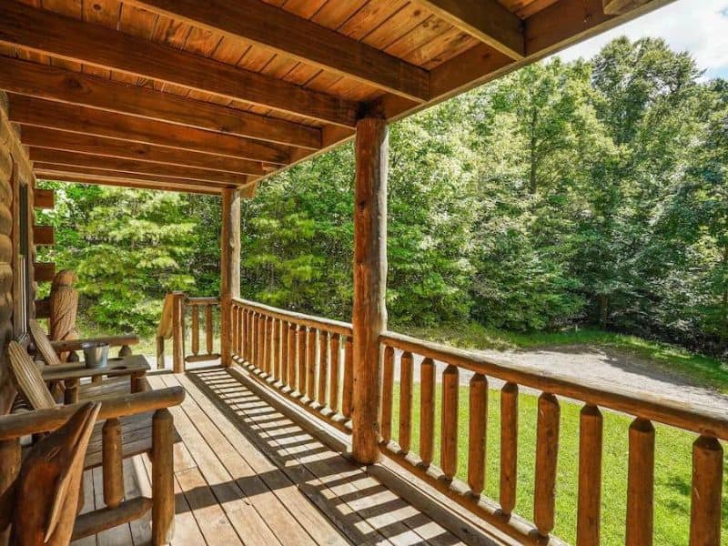 Covered wood front porch at vacation rental in Hocking Hills