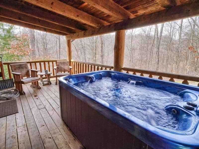 Covered hot tub on deck at a Hocking Hills cabin rental