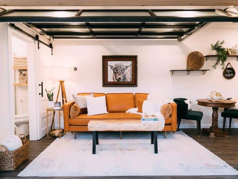 Couch and living area in modern shipping container home in Hocking Hills