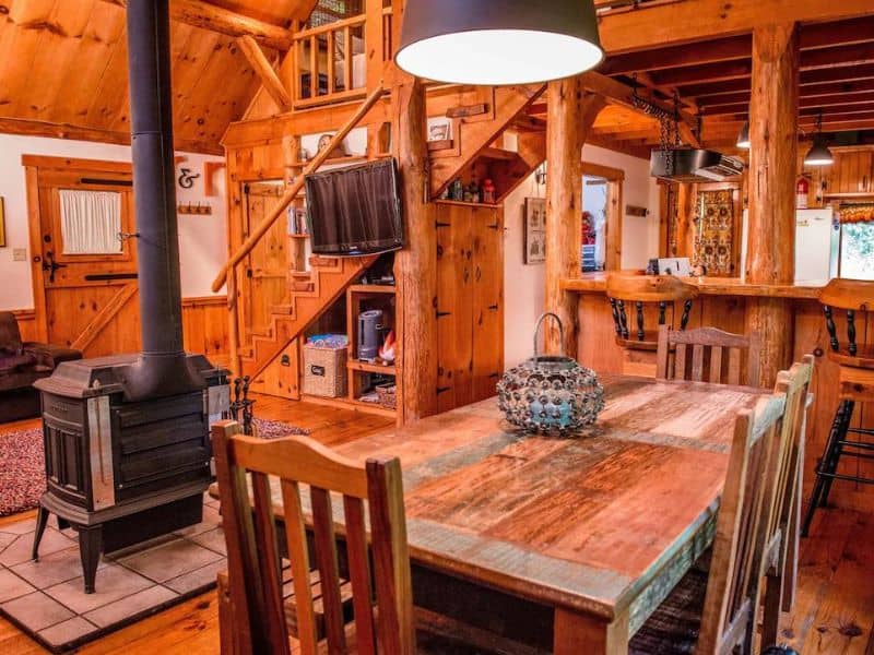 Fireplace and living area at wood cabin rental near Hocking Hills, OH