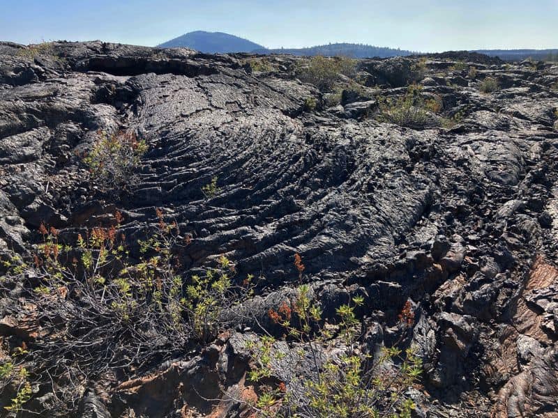 Dried lava at Craters of the Moon National Monument in ID - a fun overnight stop on a Seattle to Yellowstone road trip