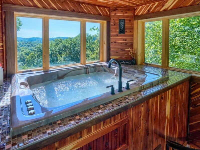 Romantic indoor spa tub at Hocking Hills treehouse rental