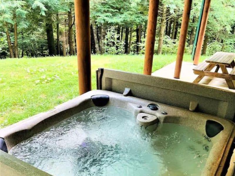 Covered outdoor hot tub at Hocking Hills cabin vrbo