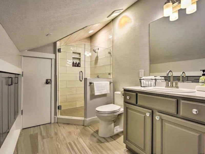 Modern bathroom with a walk-in shower and spacious vanity.