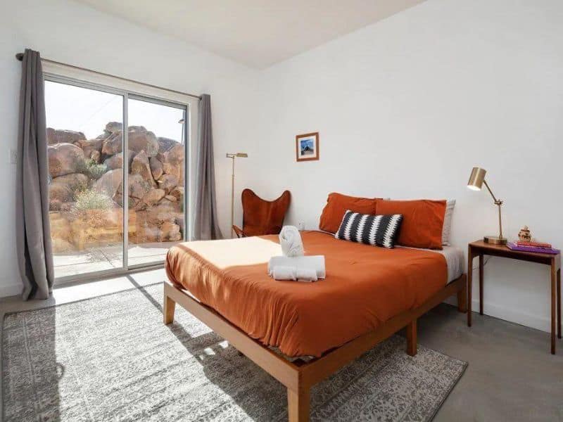 Bedroom with outdoor boulder views at Joshua Vrbo lodging