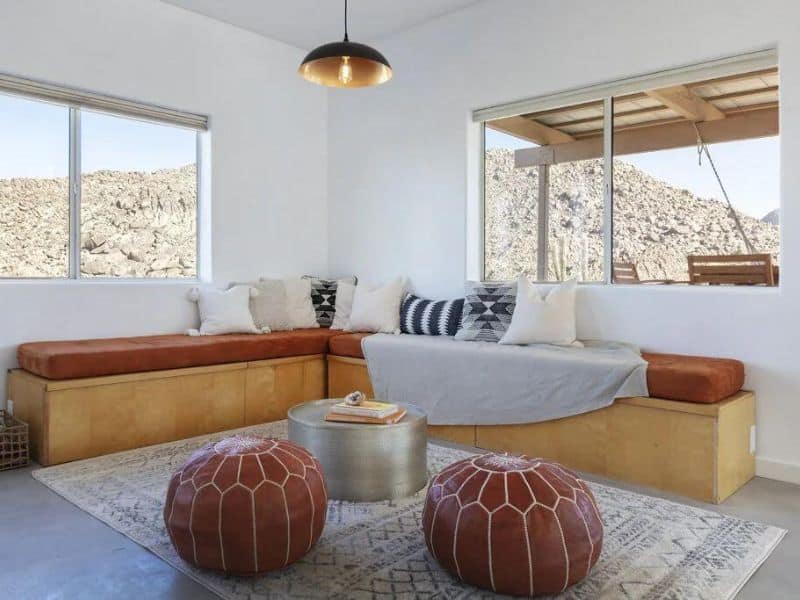 Minimalist living area with desert views at Joshua Tree house rental on Vrbo