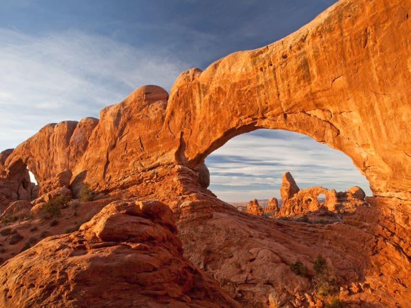 Arch in Arches National Park near Moab, Utah with more rock features in the background