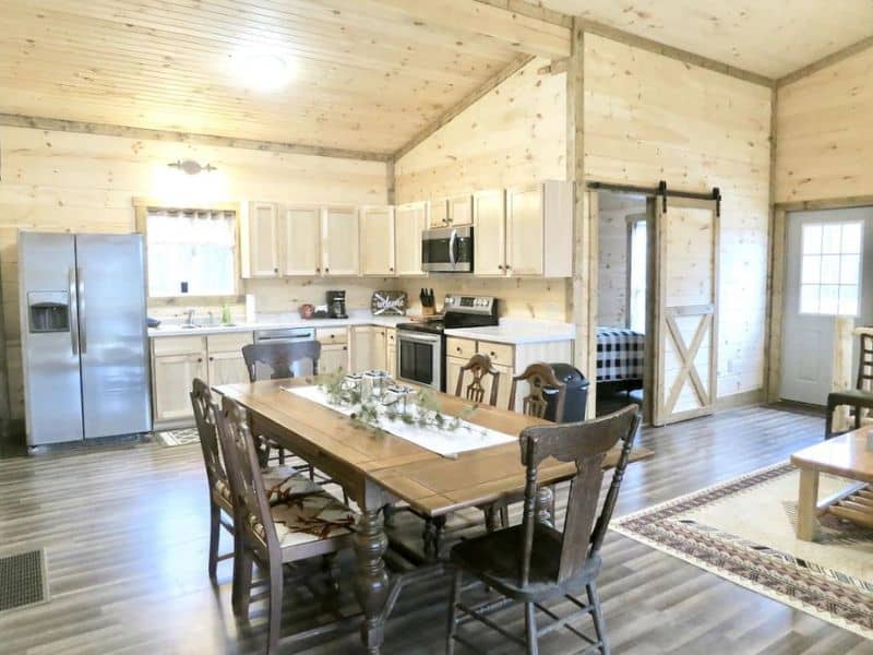 Open plan kitchen and dining area in rustic modern cabin in Hocking Hills