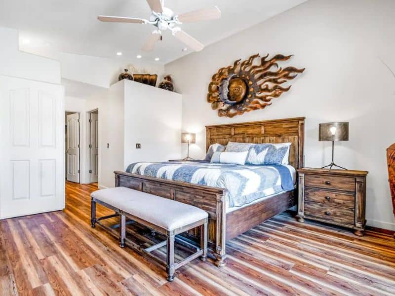 Modern king bedroom with wall decor at Moab vacation rental in Rim Village