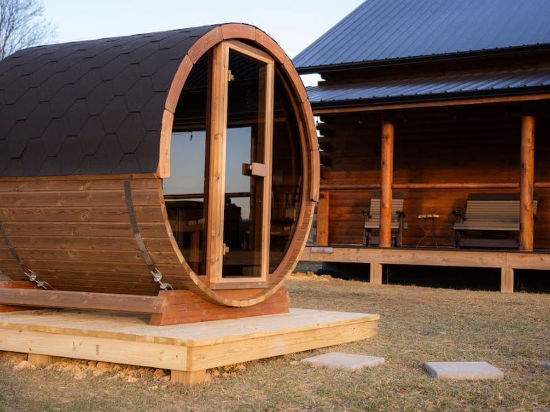 Wooden Barrel Sauna at Shurtz Overlook Vrbo rental in Hocking Hills: A unique wooden barrel-shaped sauna located outside the cabin.