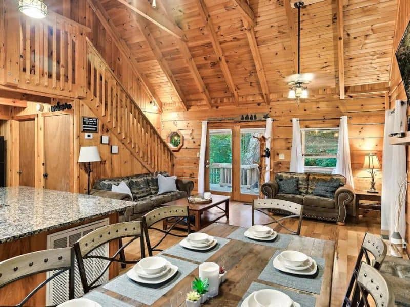 Open plan living area in Gatlinburg vacation rental with dining table