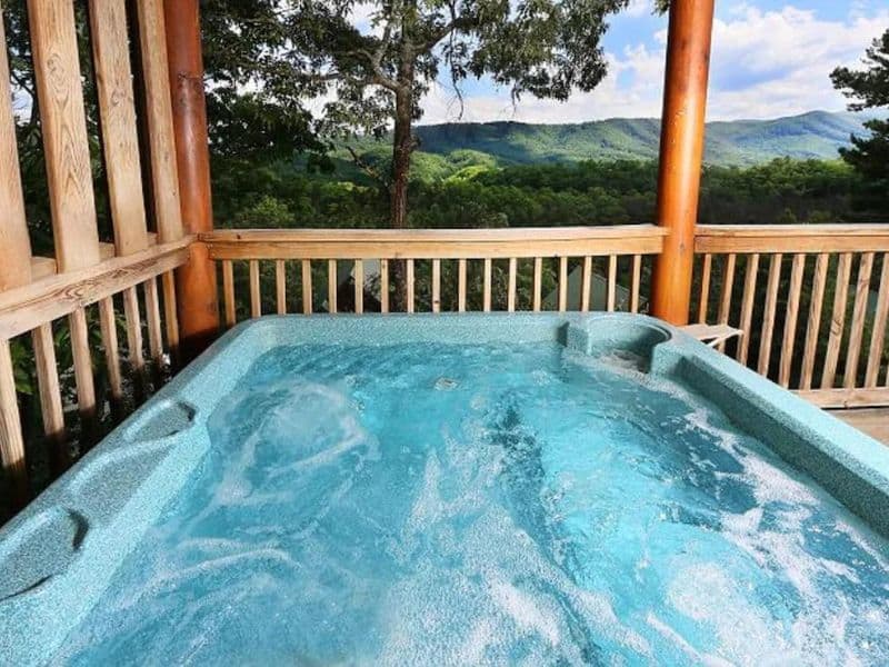 Hot tub on deck at Gatlinburg cabin rental with views over the Great Smoky Mountains