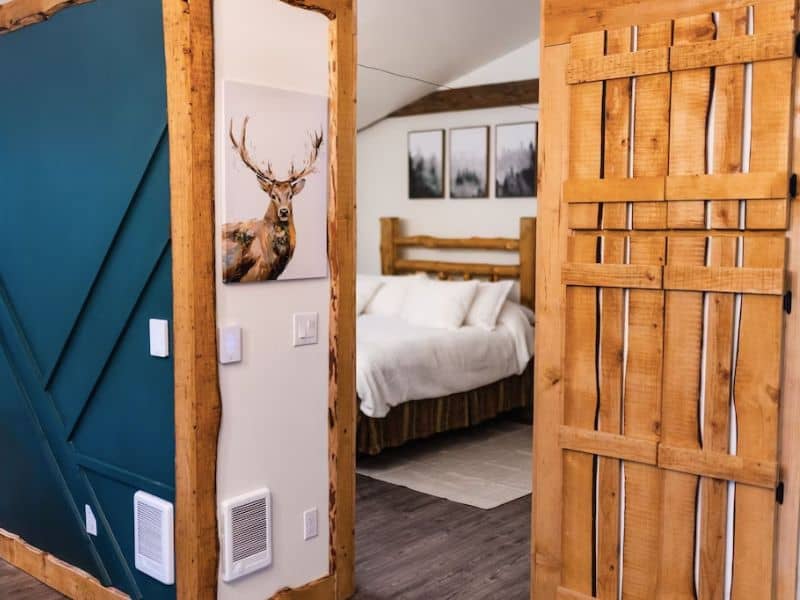 Trendy rustic interior of cabin near Mt Rainier with deer artwork and rustic modern furnishings