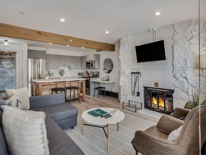 A living room with a fireplace and a couch.