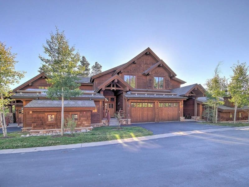 A large Breckenridge ski in walk out home rental with a garage and driveway.