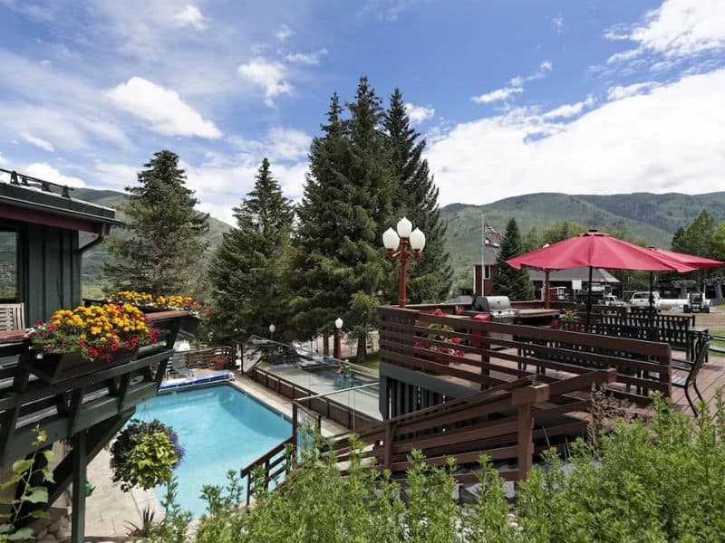 A resort with a swimming pool and patio.