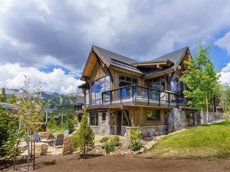 A luxury ski in ski out home in Breckenridge CO with a large front yard.