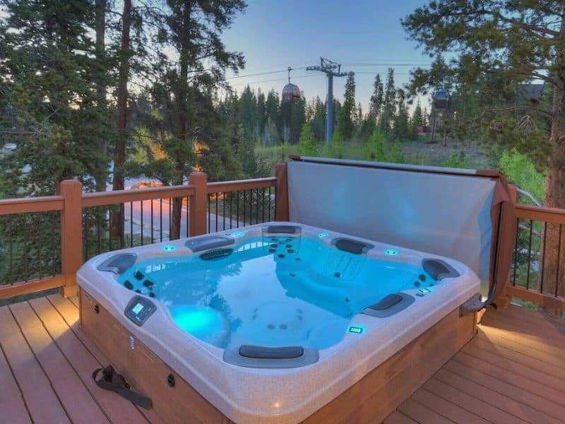 A hot tub on the deck of a ski in ski out Shock Hill rental in Breckenridge, CO.