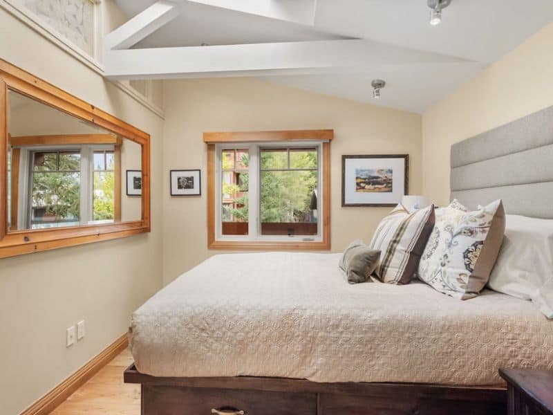 A bedroom with a large bed and a window in Aspen CO.