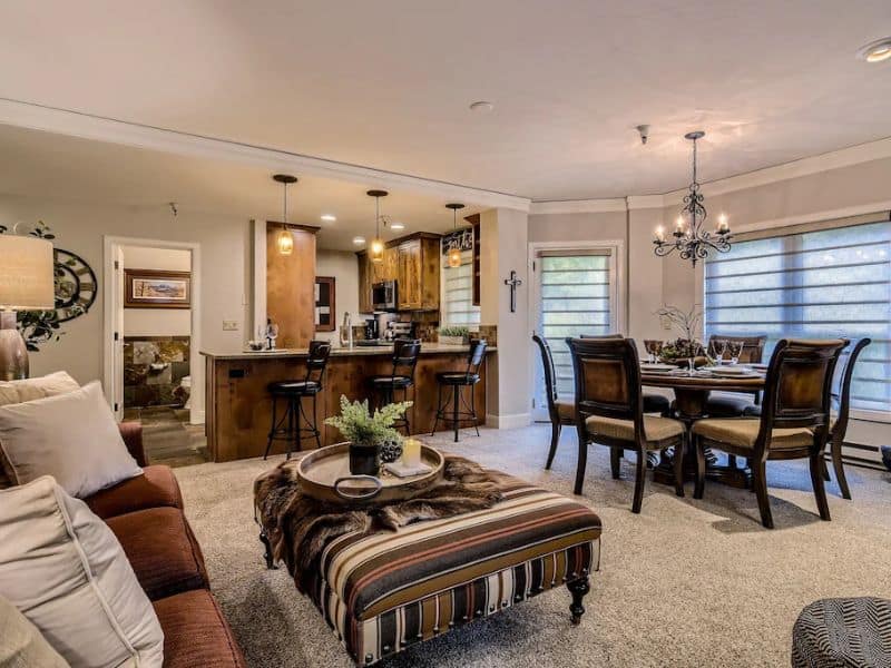 A living room with a dining table and chairs in Breckenridge CO.