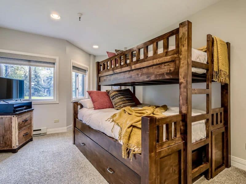 A bunk bed in a bedroom with a TV in Breckenridge CO.
