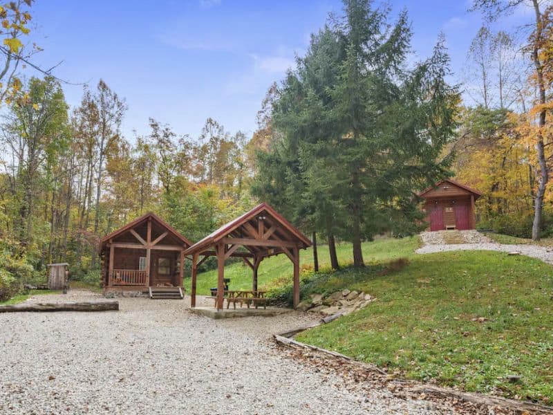 Three Pines Cabin for 2 in Hocking Hills OH with covered picnic table and lots of trees.