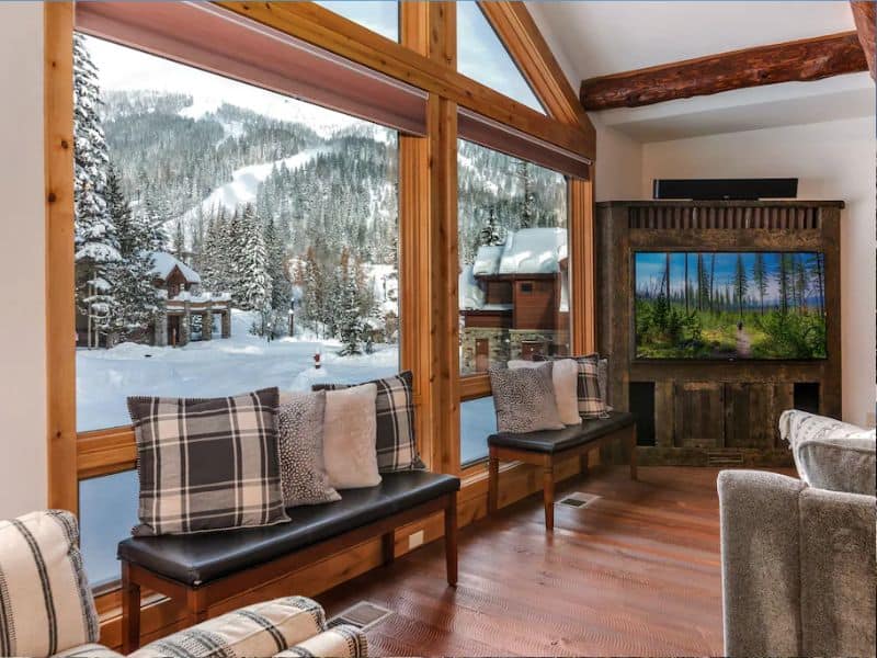 A Whitefish MT rental with large windows overlooking the mountains.