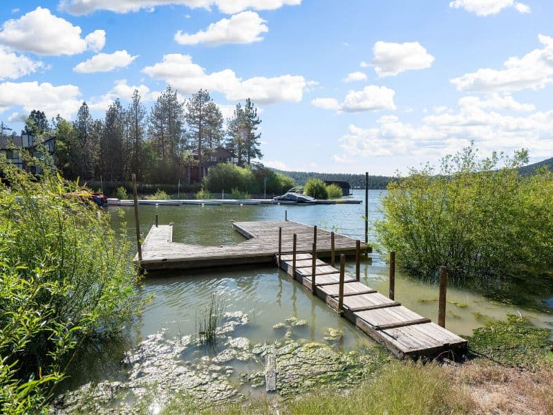 Private dock extending into the lake from a Big Bear cabin on the lake.