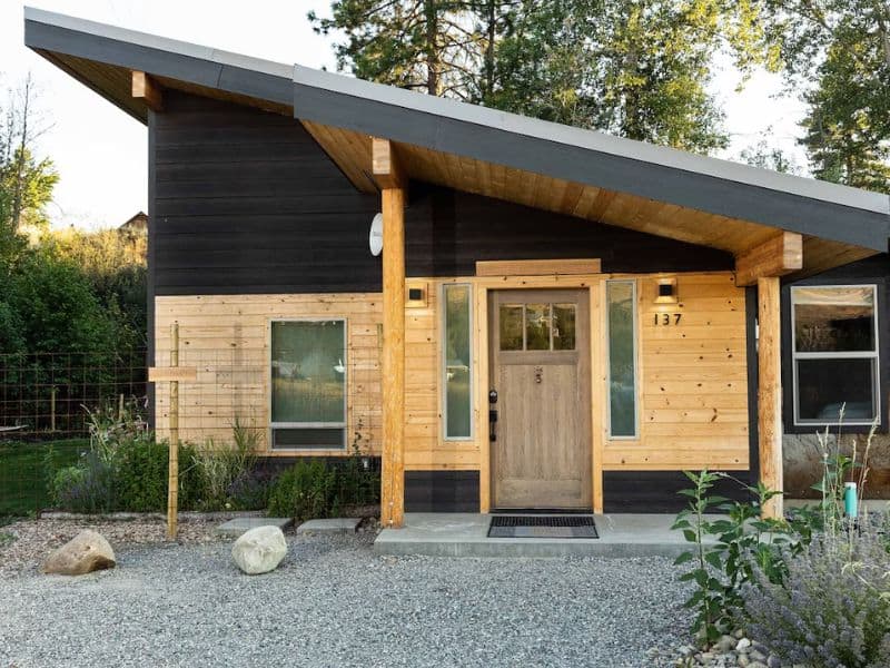 Rustic modern vrbo cabin Winthrop Basecamp, with tilted statement roof and natural wood finishes.